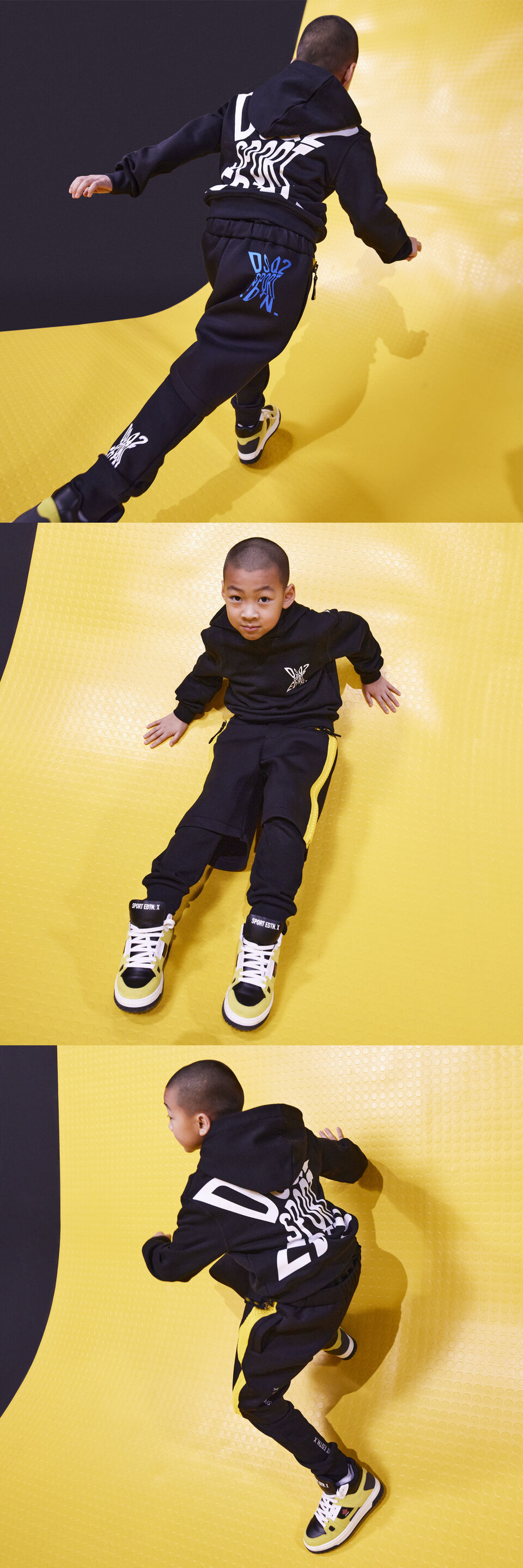 A little boy wearing a black jacket with a coordinate pants 